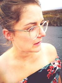 Close-up of young woman wearing sunglasses