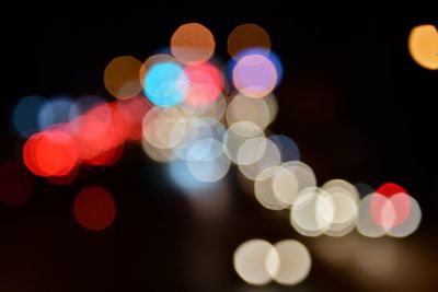 Defocused image of illuminated lights at night