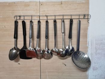 Clothes hanging on wall in kitchen