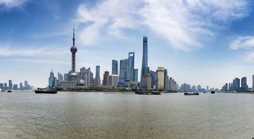 Modern buildings in city against sky