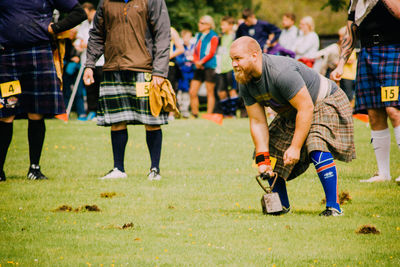 People playing soccer on field