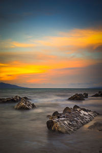 Scenic view of sea against sky during sunset