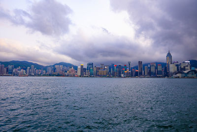 Panoramic view of sea and buildings against sky