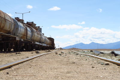 Freight train against sky