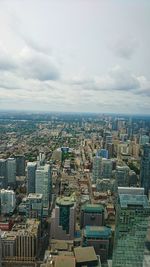 High angle view of modern buildings in city against sky