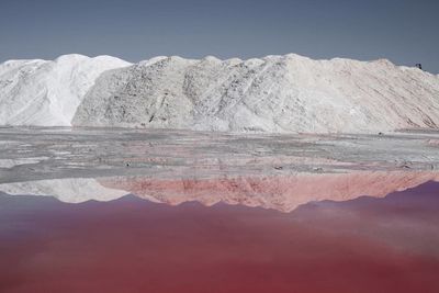 Scenic view of lake against mountain range