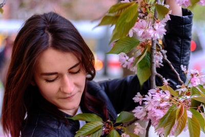 Close-up of woman with flower bouquet