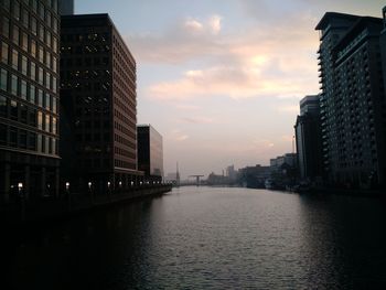 Buildings in city at dusk