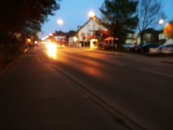 View of city street at sunset