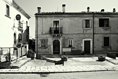 Street amidst residential buildings against sky