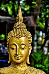 Close-up of gold statue of buddha