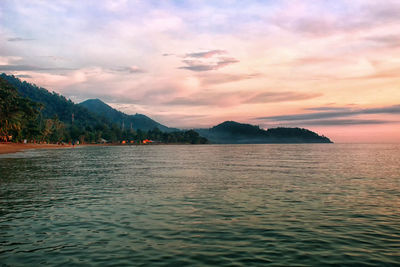 Scenic view of lake against sky during sunset