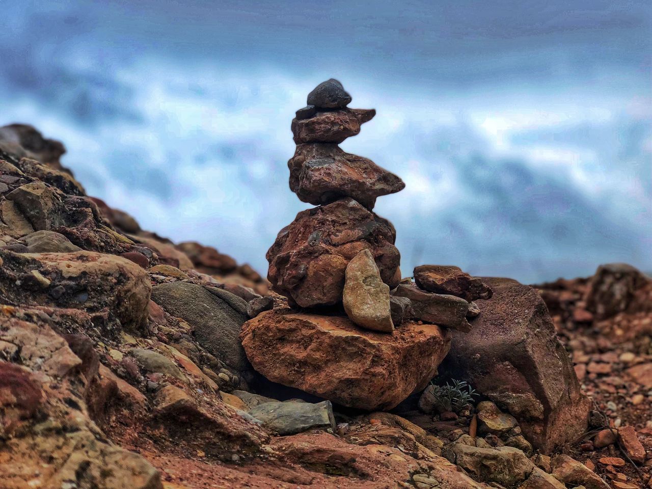 rock, solid, rock - object, stone - object, cloud - sky, balance, sky, nature, stack, no people, tranquility, zen-like, day, textured, focus on foreground, beauty in nature, stone, land, close-up, outdoors, pebble