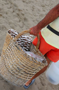 Seller of coconut and fresh fruit on the beach of the tourist resort