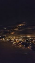 Aerial view of sea against sky at night