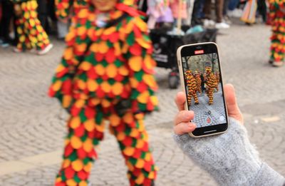 Midsection of woman using mobile phone