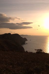 Scenic view of sea at sunset