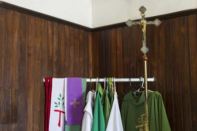 Close-up of clothes hanging on wood