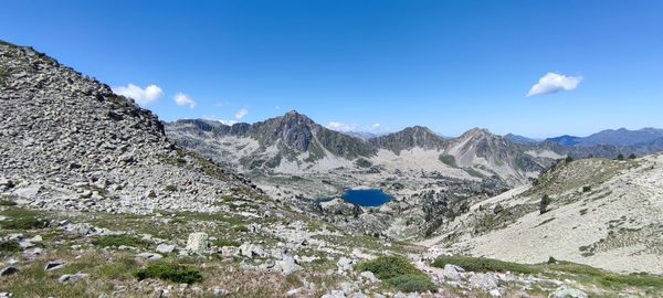 Scenic view of mountains against clear blue sky