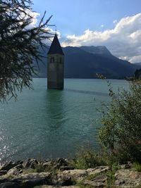Sunken village, tower of a church in the lake