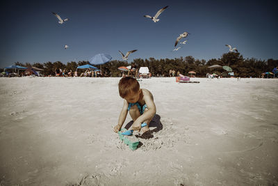 Boy playing at beach