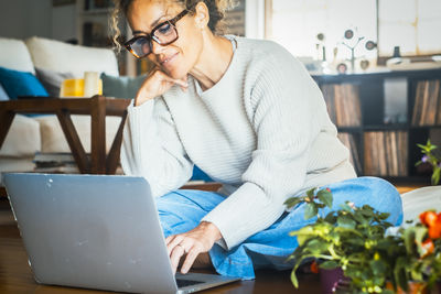 Young man using laptop at home