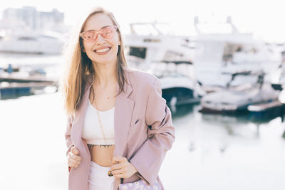 Portrait of a smiling young woman standing outdoors