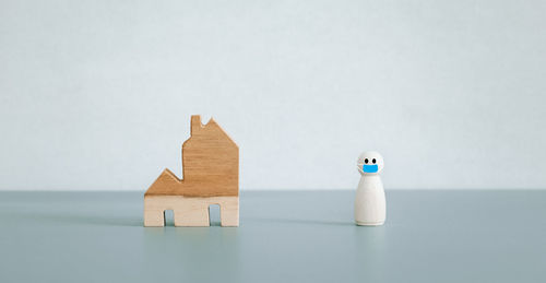 Close-up of stuffed toy on table against white background