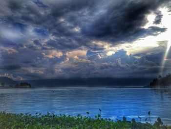 View of lake against cloudy sky