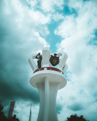 Low angle view of statue against sky