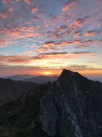 Scenic view of mountains against sky during sunset