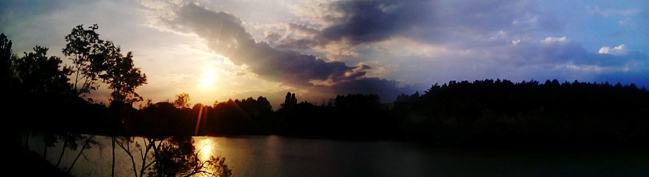 SCENIC VIEW OF LAKE AT SUNSET