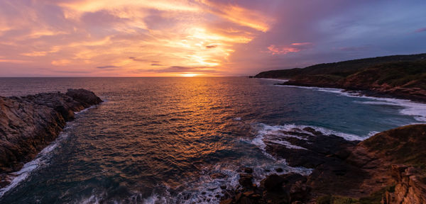 Scenic view of sea against sky during sunset