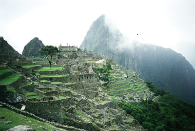 Panoramic view of castle on mountain against sky
