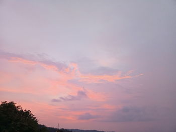 Low angle view of dramatic sky during sunset