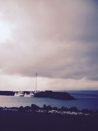 Scenic view of sea against cloudy sky