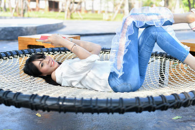 Portrait of woman lying on floor