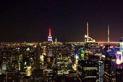 Illuminated buildings in city at night