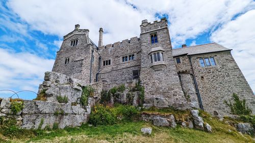 Low angle view of old ruins against sky