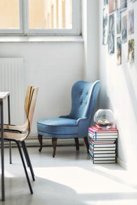 Stack of books and chairs in office