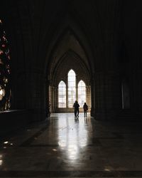 People walking in corridor