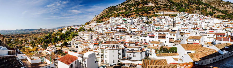 Panoramic view of white village of mijas by mountains