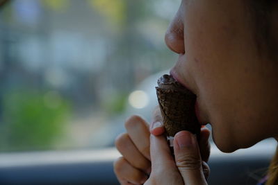 Close-up of man eating ice cream