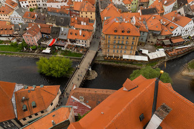 High angle view of houses by river in town