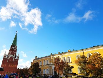 Low angle view of buildings against blue sky