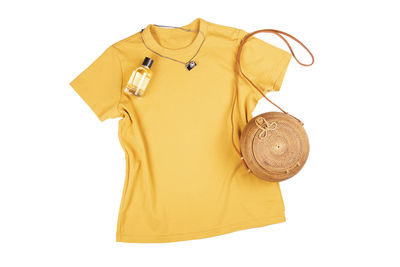 Close-up of hat hanging against white background