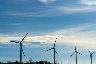 Low angle view of wind turbine against sky