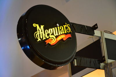 Low angle view of illuminated sign on stage