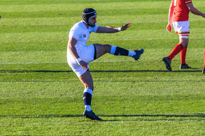 Man running on soccer field