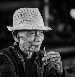 Portrait of man smoking cigarette